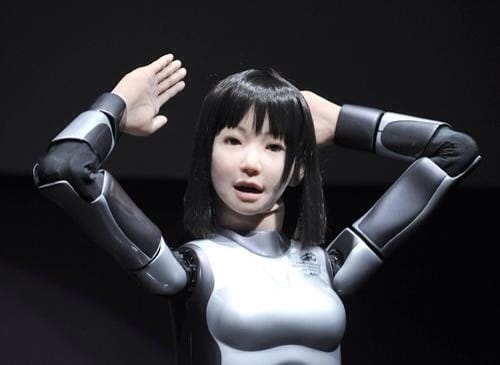 A humanoid robot, HRP-4C, developed by Japan's Advanced Industrial Science and Technology (AIST) shows off her skills during the Digital Contents Expo in Tokyo on October 22, 2009. A monster-slaying bad breath blow gun, a rain-simulating "funbrella" and a navigation-aid helmet that steers users by pulling their ears: welcome to Japan's latest whacky inventions. These bizarre gadgets and more -- some of them useful, most of them fun -- went on display at the Digital Content Expo, a fair showcasing futuristic gaming, arts, medical and other technologies that opened on October 22. AFP PHOTO / Yoshikazu TSUNO (Photo credit should read YOSHIKAZU TSUNO/AFP/Getty Images)